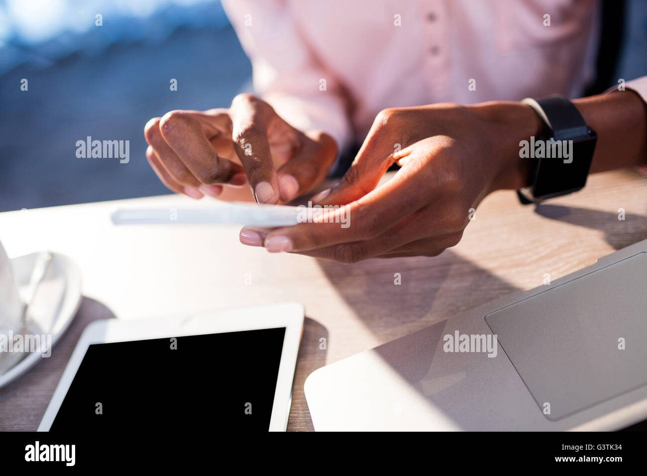 Business people using a smartphone Stock Photo
