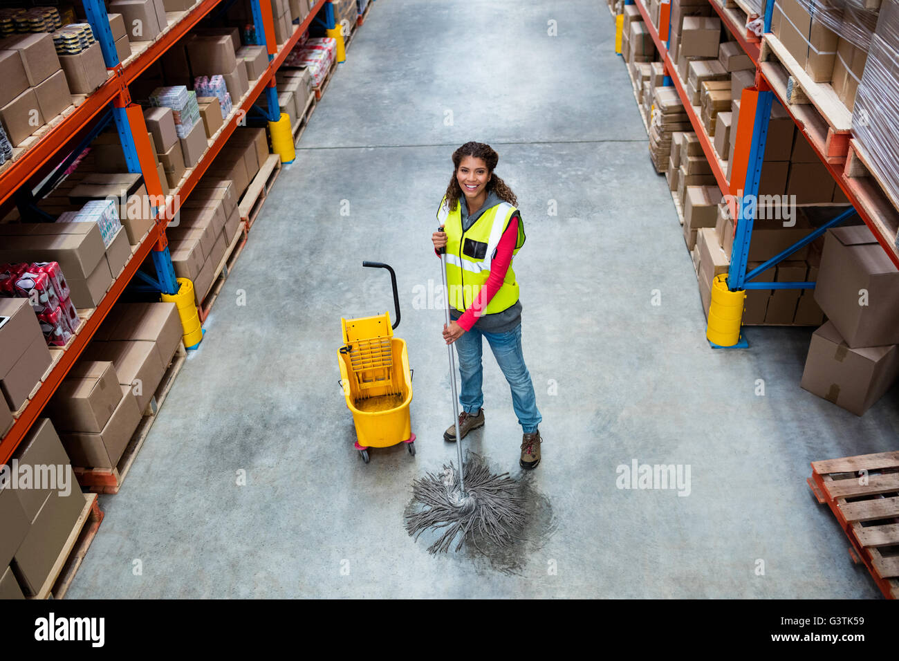 Moping Handler Woman moping warehouse floor Stock Photo - Alamy