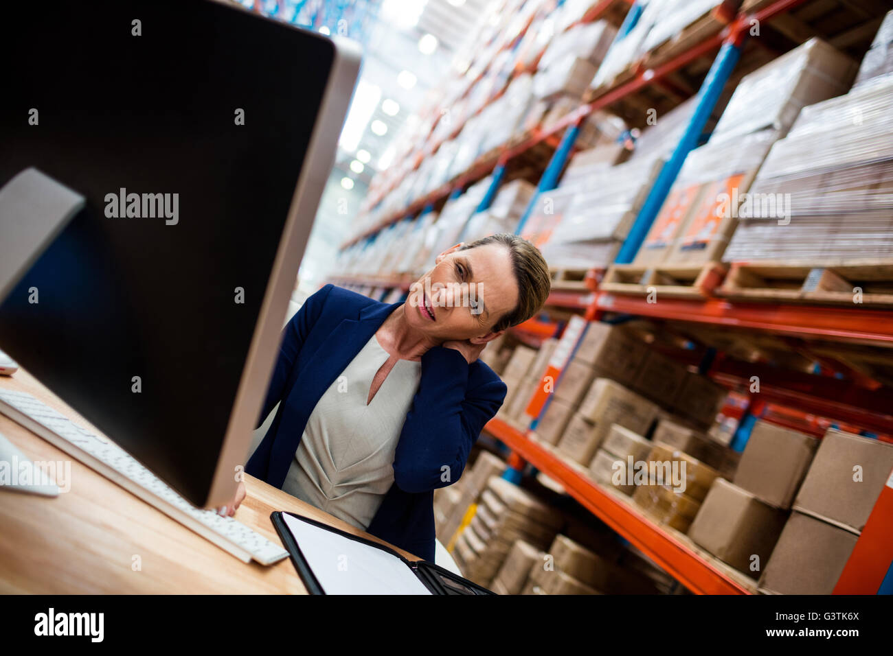 Warehouse manager with shoulder pain Stock Photo