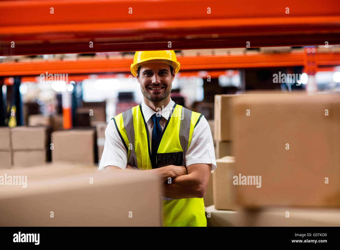 Warehouse manager standing with helmet Stock Photo
