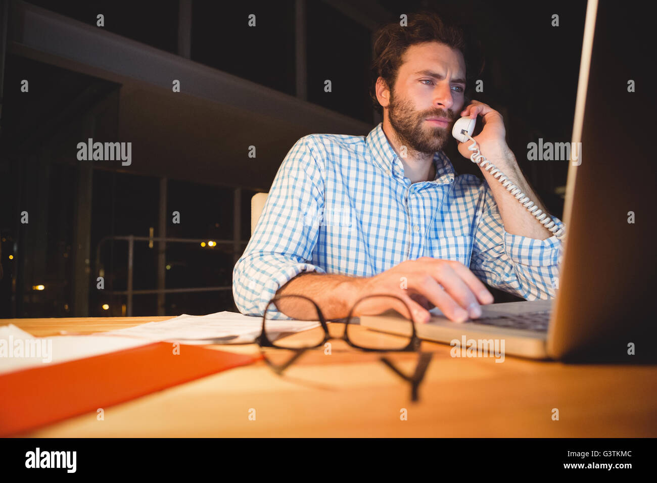 Businessman making a phone call at night Stock Photo Alamy