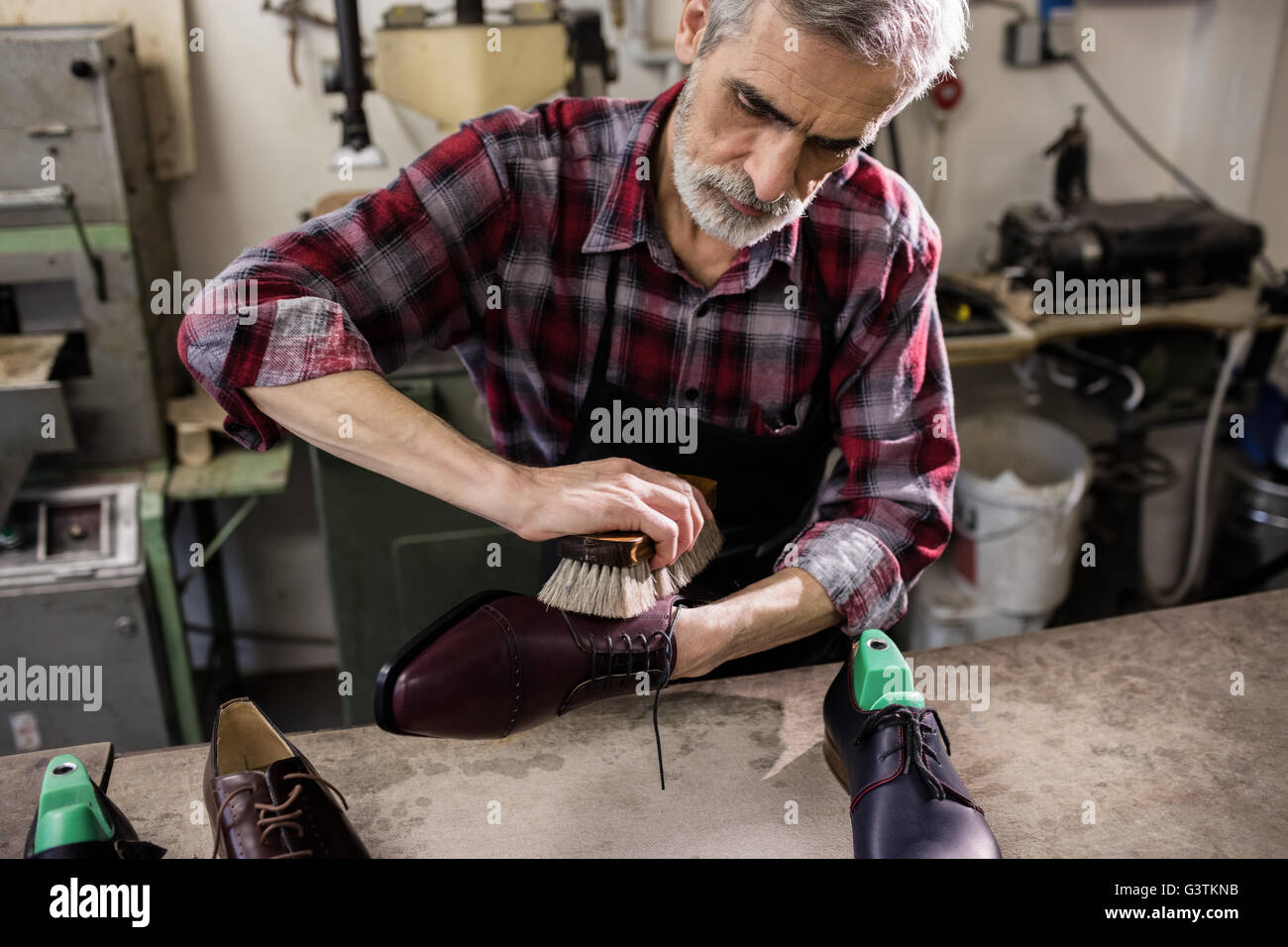 Cobbler polishing a shoe Stock Photo Alamy