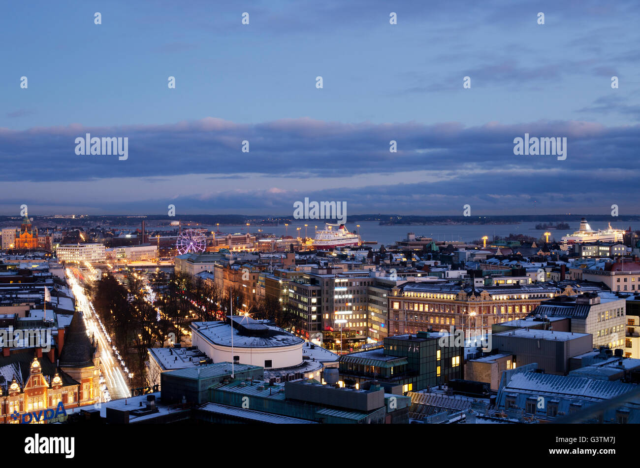 Finland, Helsinki, Illuminated cityscape at dusk Stock Photo