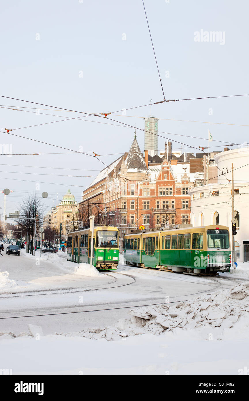 Finland, Helsinki, Mannerheimintie, Tramways on street in winter Stock Photo