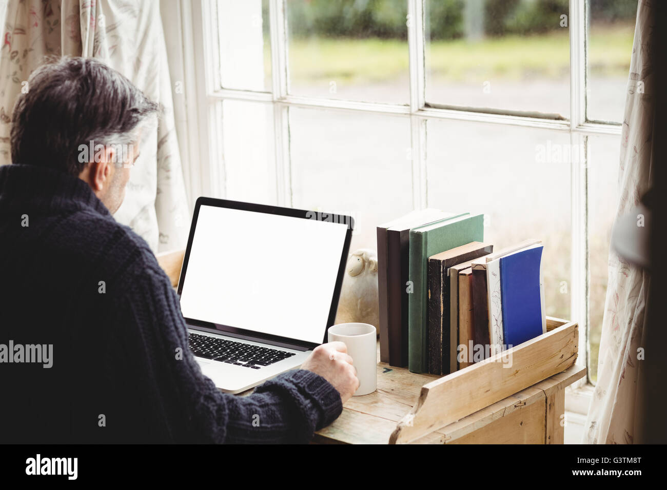 Mature man laptop typing hi-res stock photography and images - Alamy