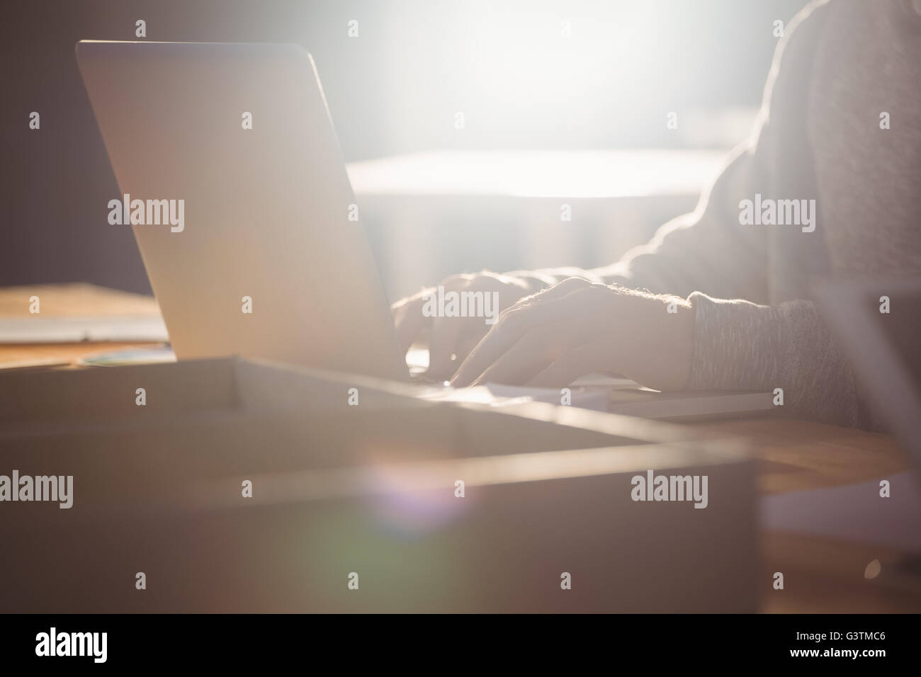 Hands typing on a computer Stock Photo