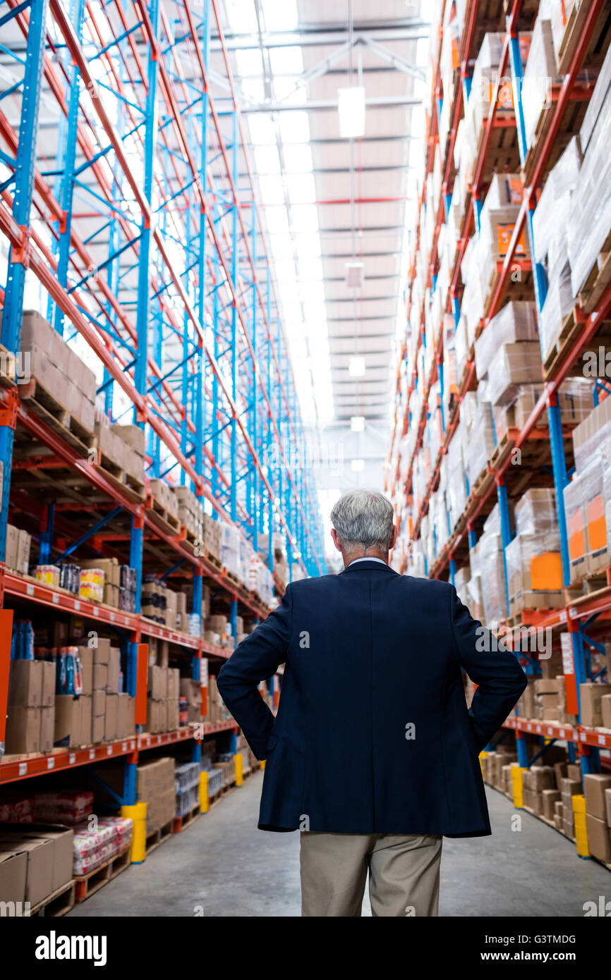 Warehouse manager turns back to the camera Stock Photo