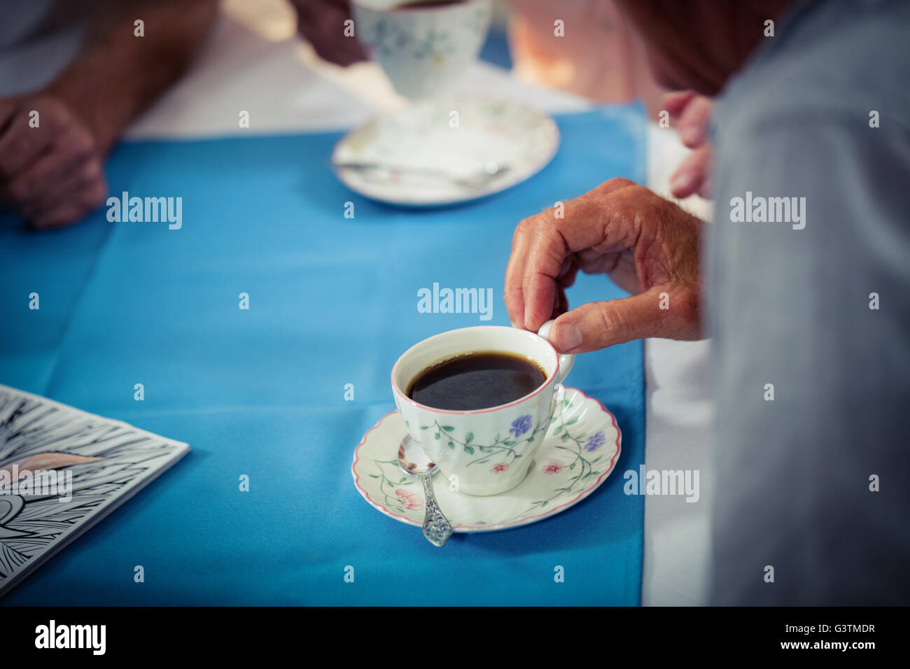 Pensioners drinking coffee Stock Photo