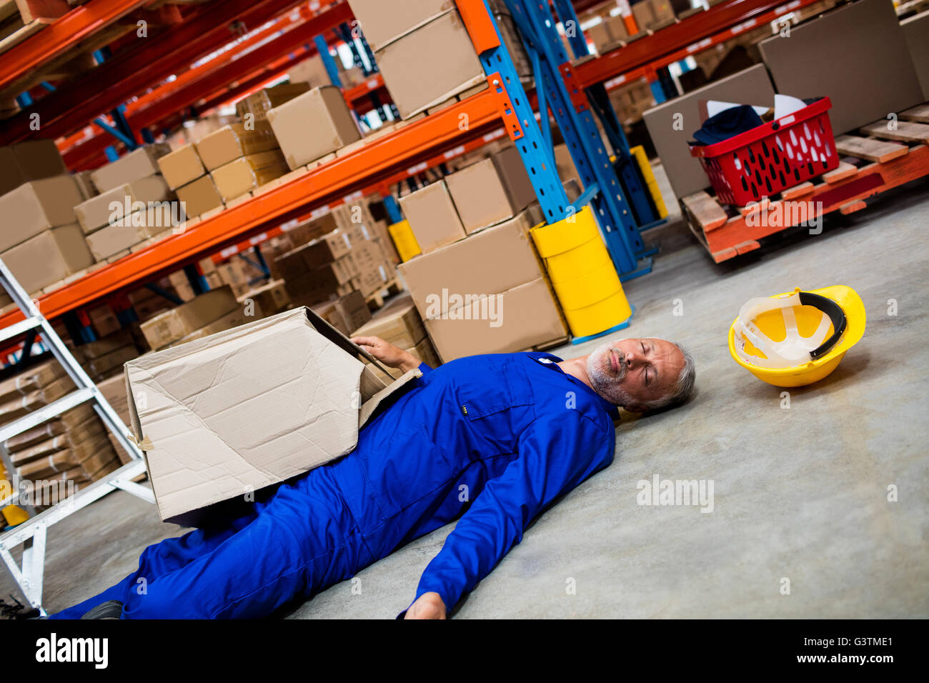 Unconscious worker lying on the floor Stock Photo Alamy