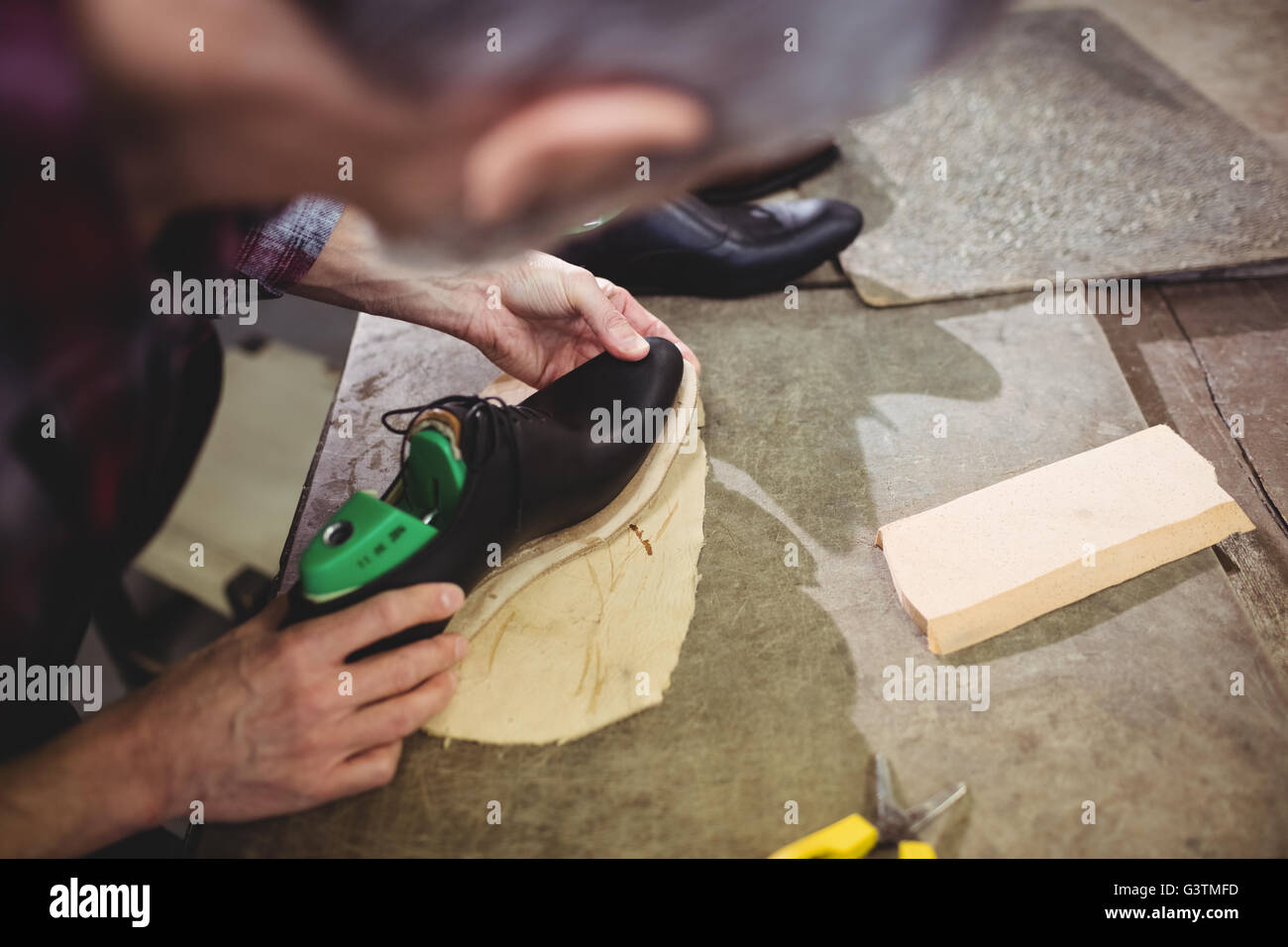 High angle view of cobbler making a shoe Stock Photo
