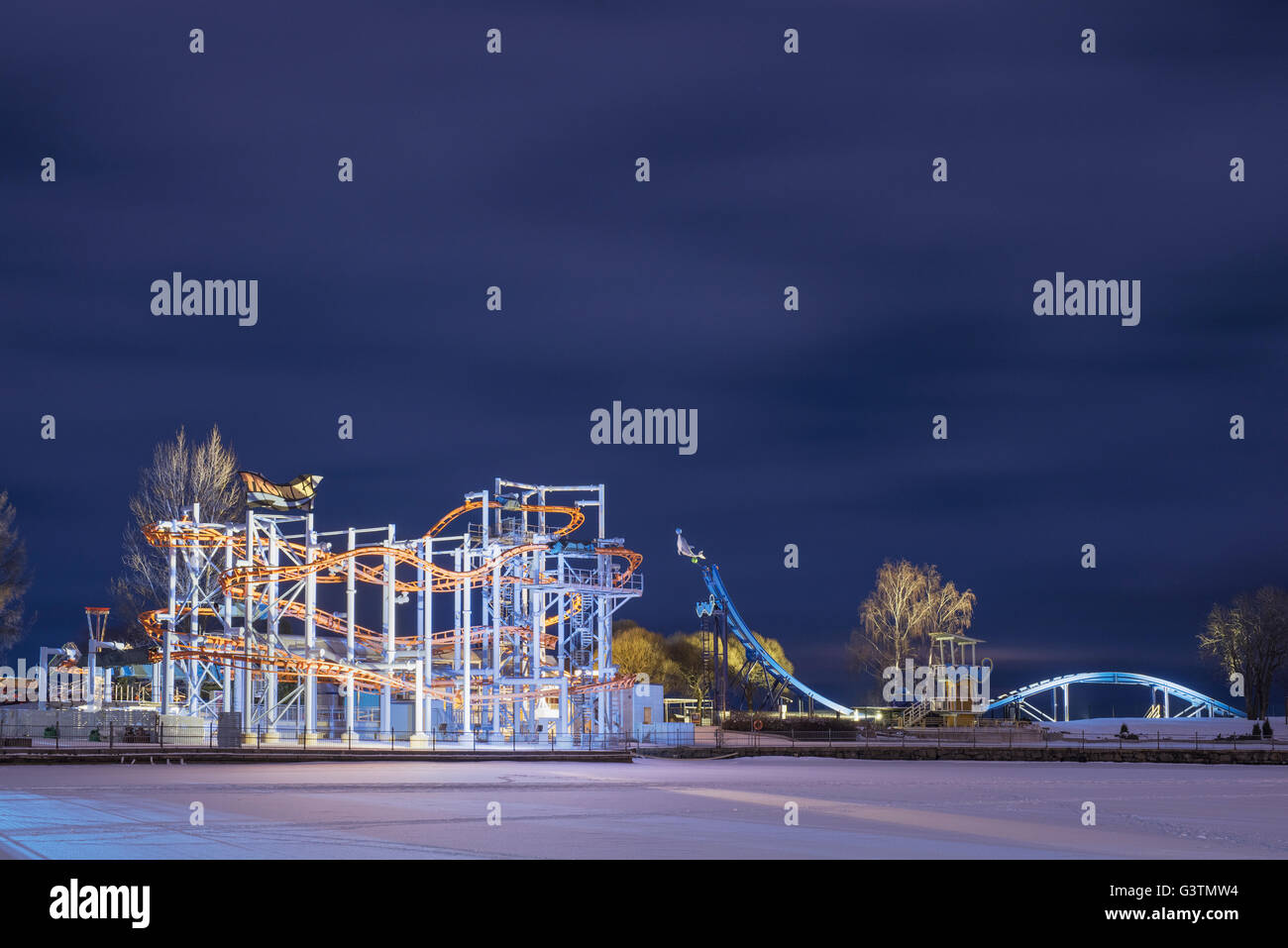 Finland, Pirkanmaa, Tampere, Nasijarvi, Illuminated rollercoaster at night Stock Photo