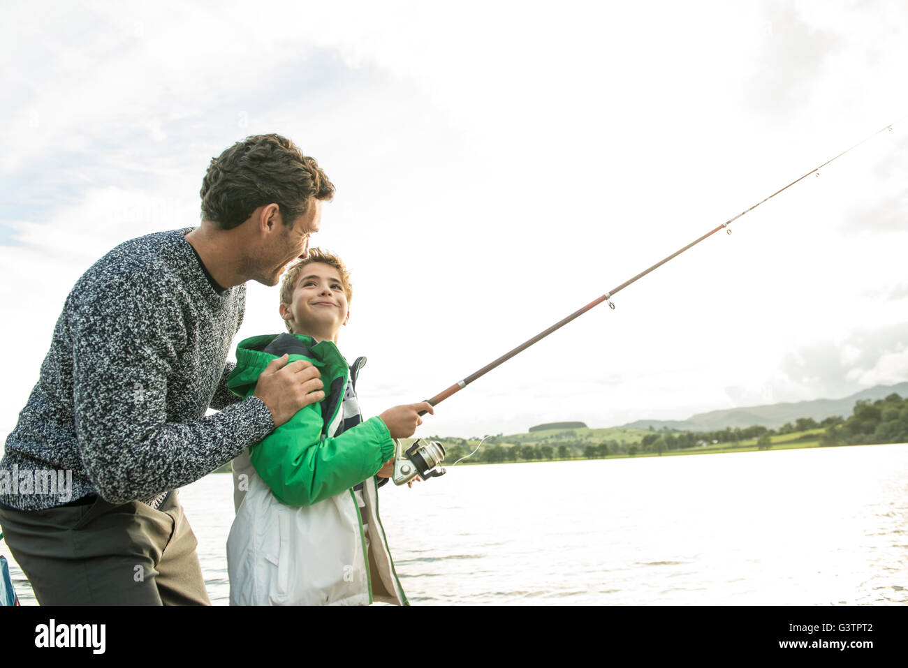 Father and son fishing on lake — Stock Photo © SashaKhalabuzar