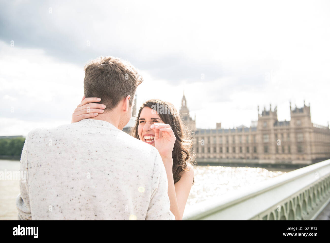 Couple hugging on bridge in hi-res stock photography and images - Alamy