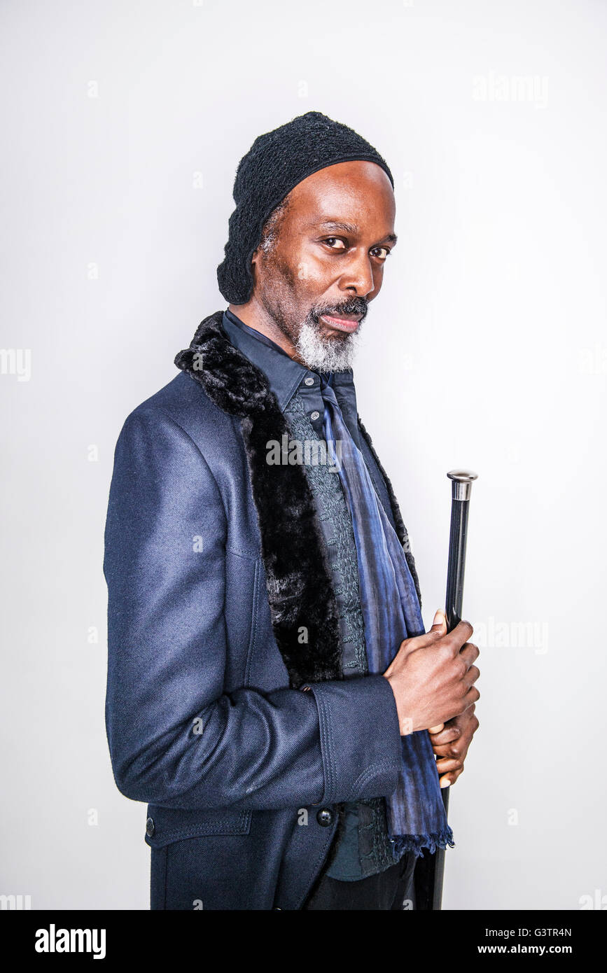 A mature african man posing in a studio looking cool. Stock Photo
