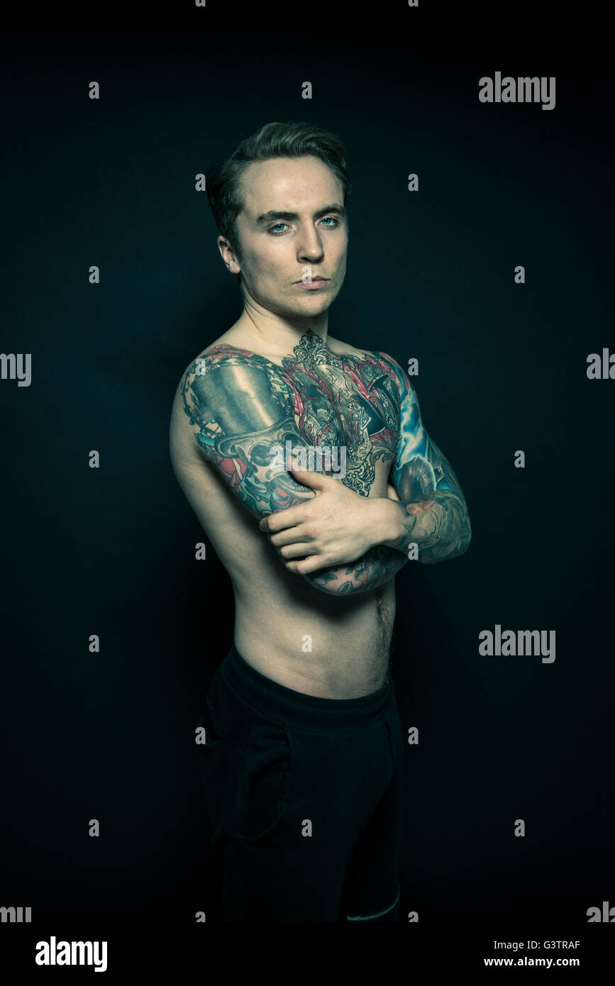 Studio portrait of a tattooed young man. Stock Photo