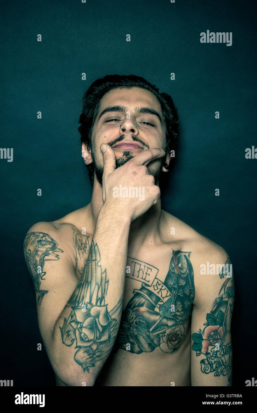Studio portrait of a tattooed young man. Stock Photo