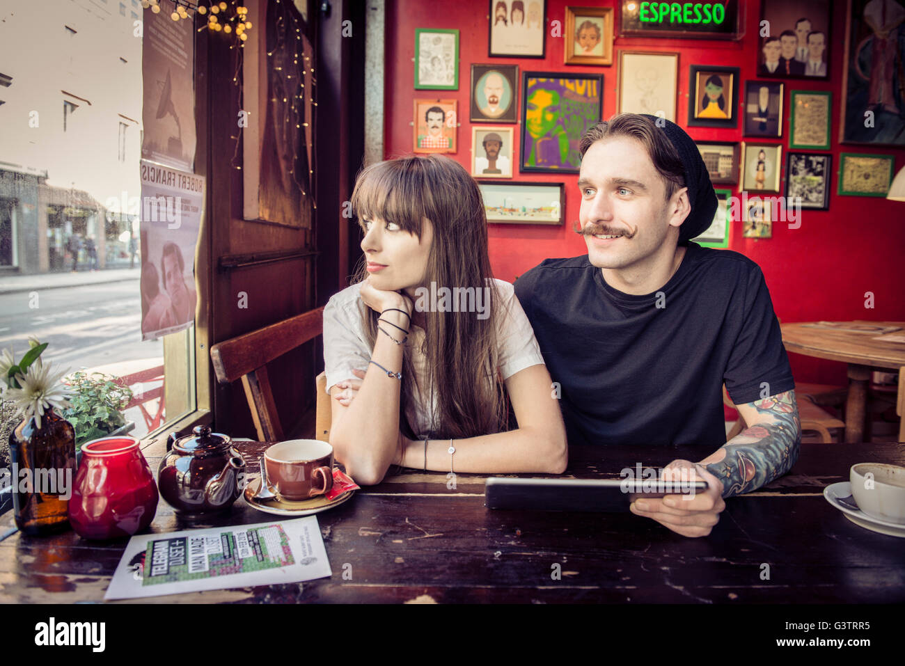 A young couple enjoying being with each other in a coffee shop in Manchester. Stock Photo