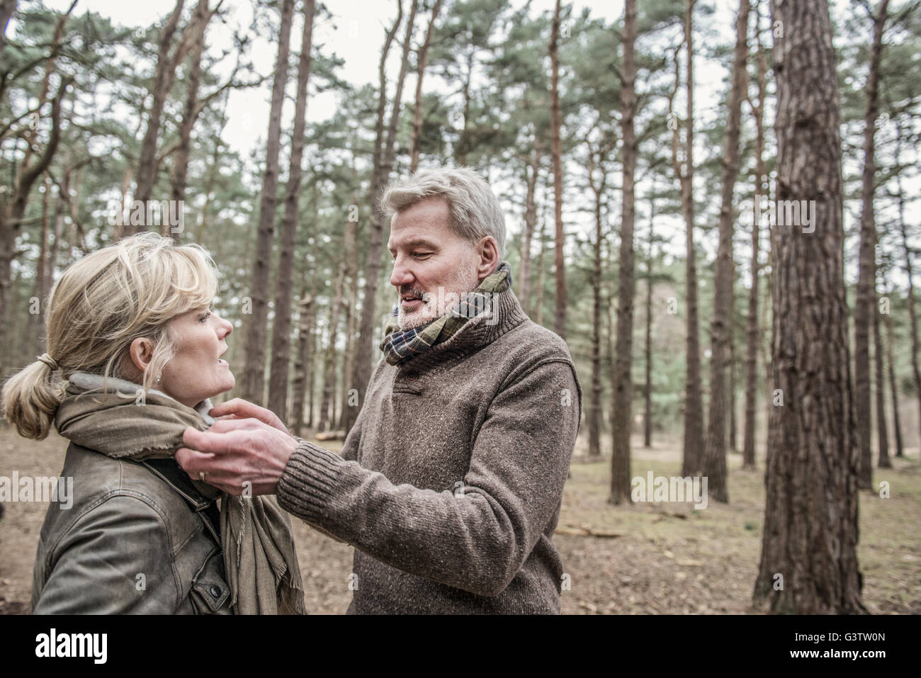 Senior couple enjoying a break during a woodland walk Stock Photo - Alamy