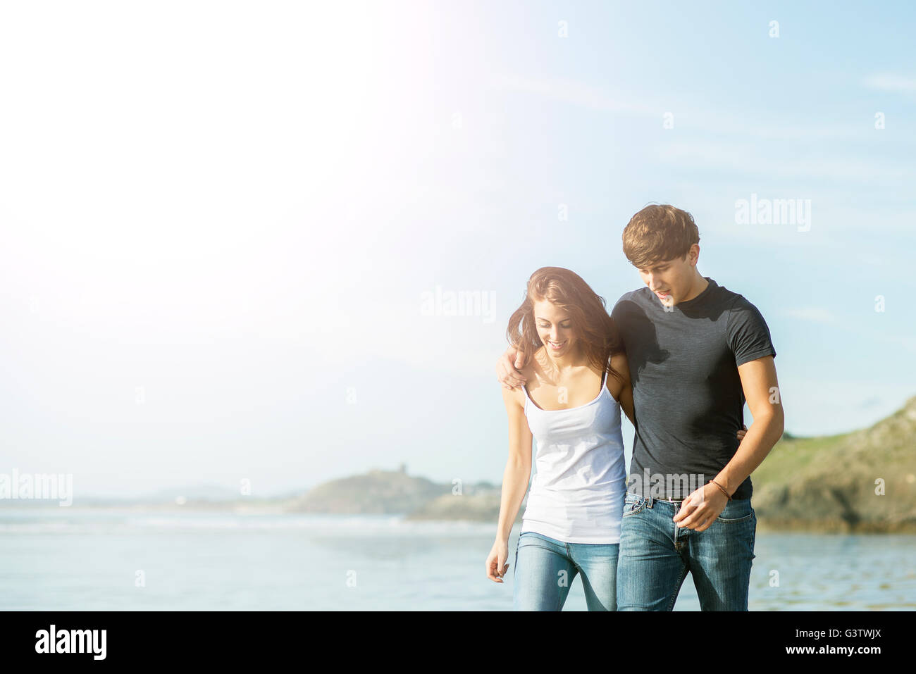 A young couple enjoying the beach at Porthmadog. Stock Photo