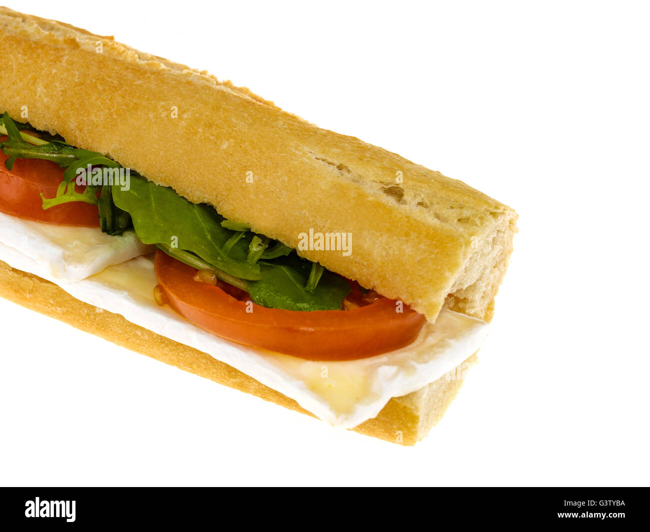 Fresh Cut Healthy Eating Brie Cheese and Tomato Baguette Bread Roll Isolated Against A White Background With Copy Space Stock Photo