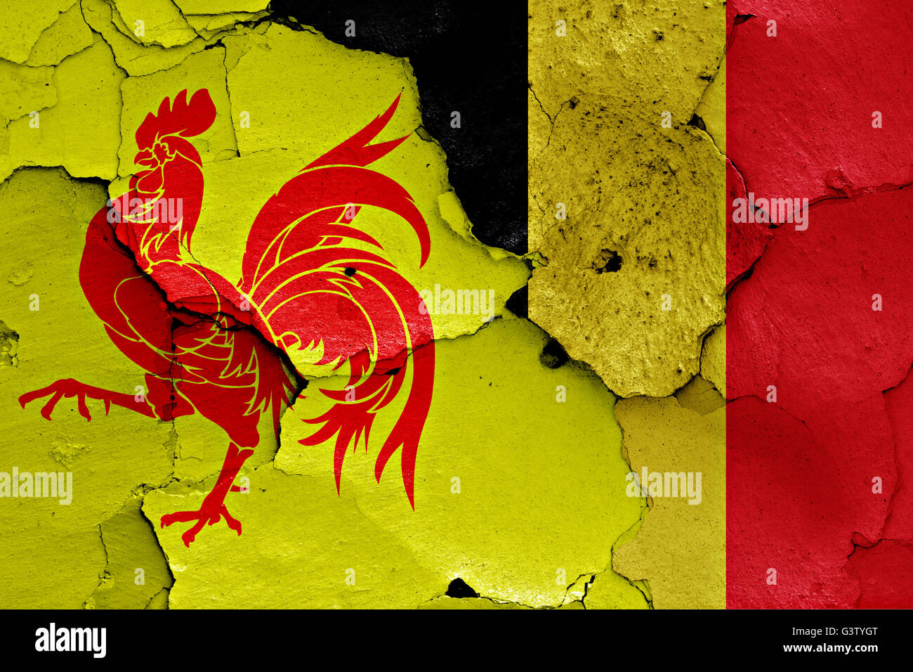 flags of Wallonia and Belgium painted on cracked wall Stock Photo