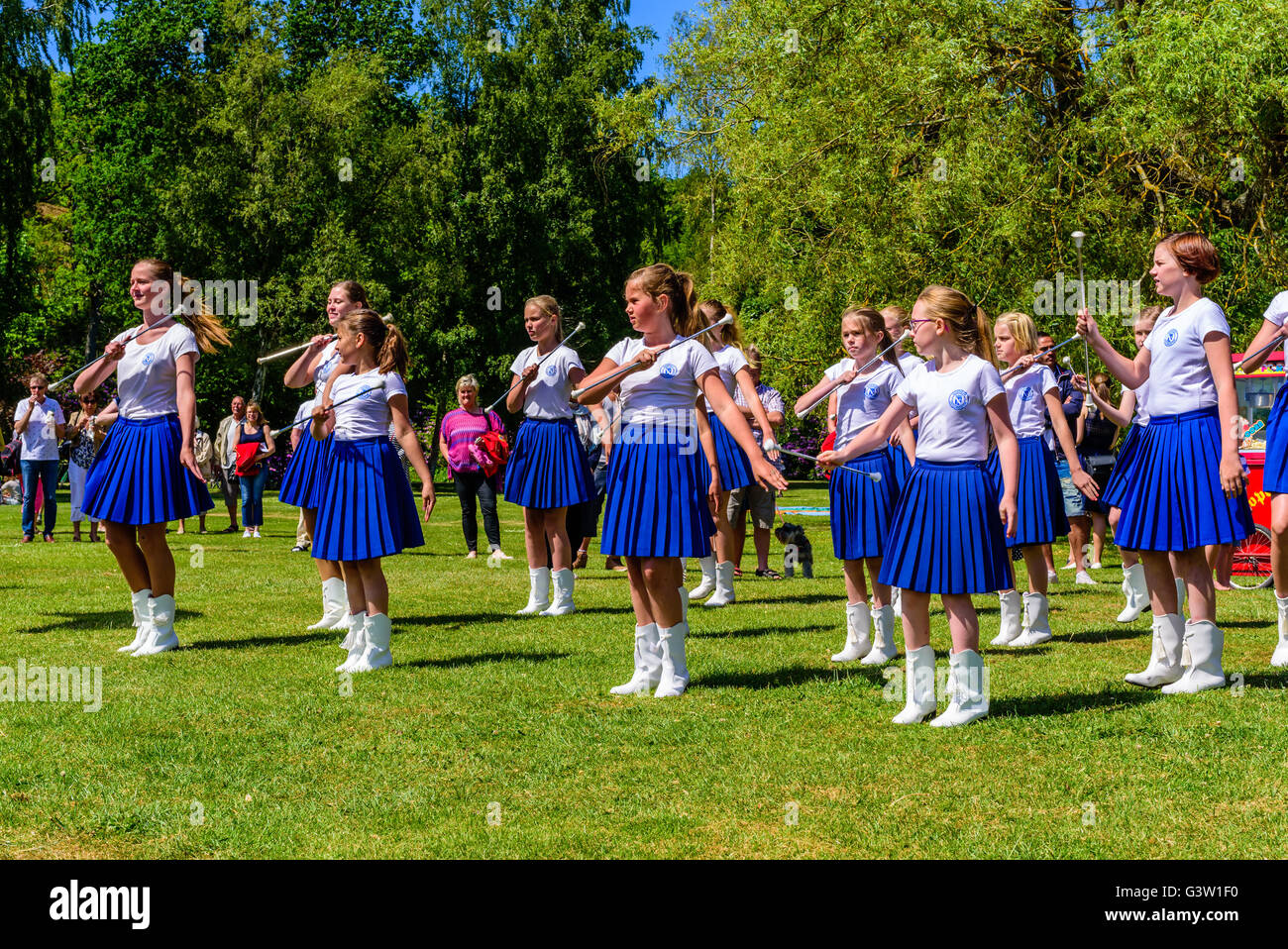 Ronneby, Sweden - June 6, 2016: The Swedish national day celebration in public park. Majorette dancers performing with batons. S Stock Photo