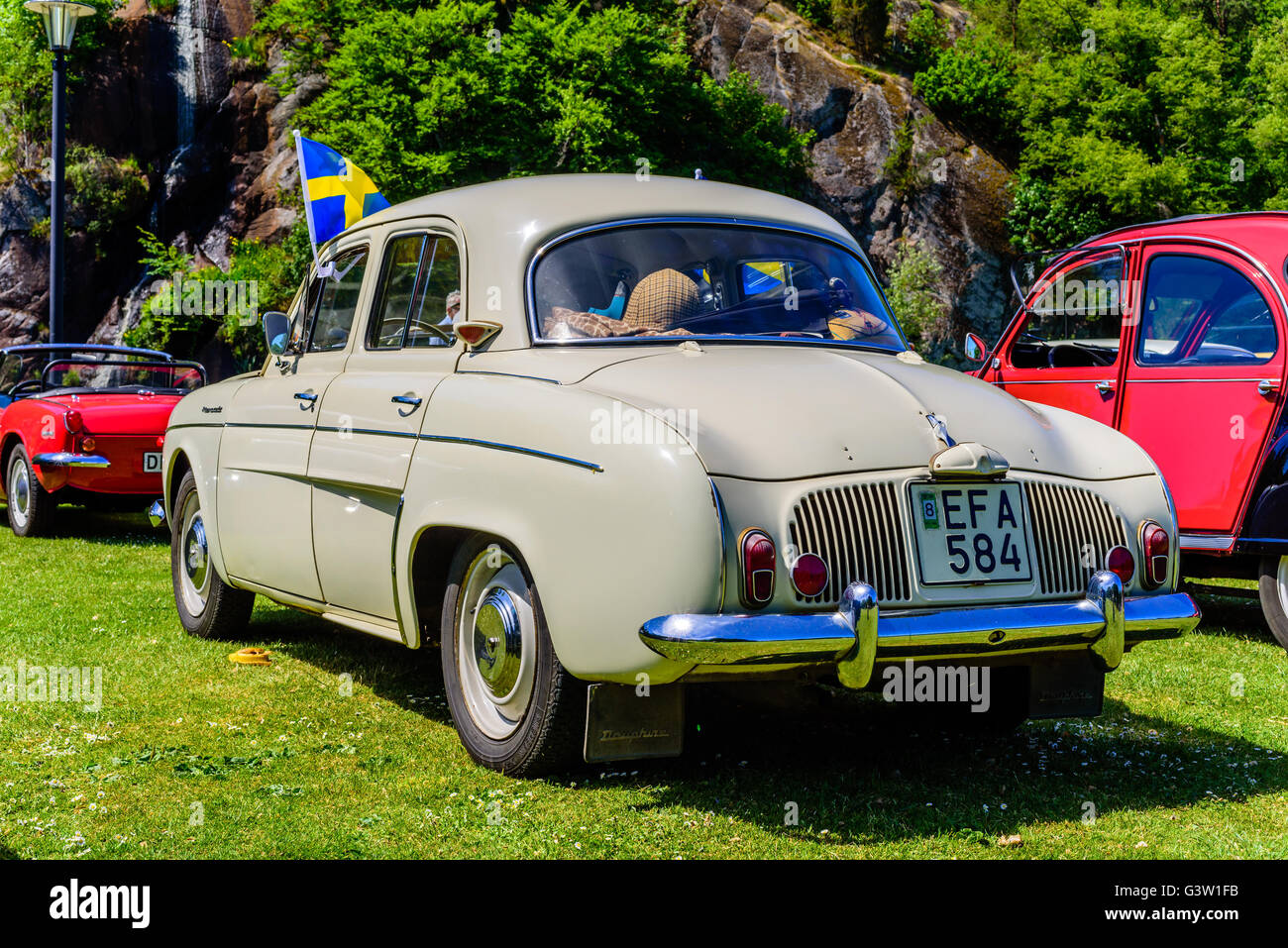 Ronneby, Sweden - June 6, 2016: The Swedish national day celebration in public park. Classic 1960 Renault Dauphine with Swedish Stock Photo