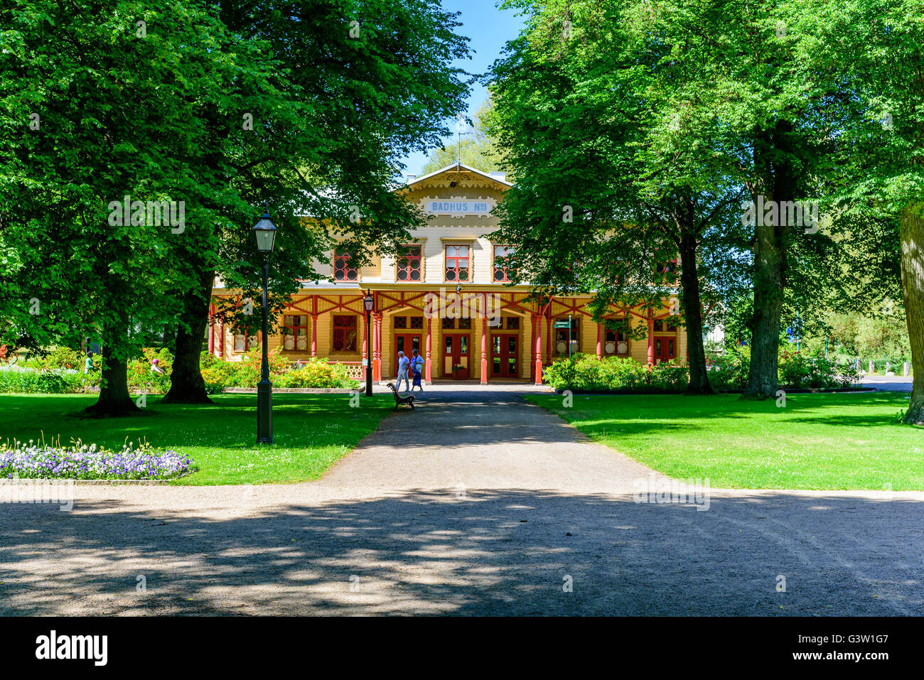 Ronneby, Sweden - June 6, 2016: Bathing house number one seen from the front with people walking by. Stock Photo