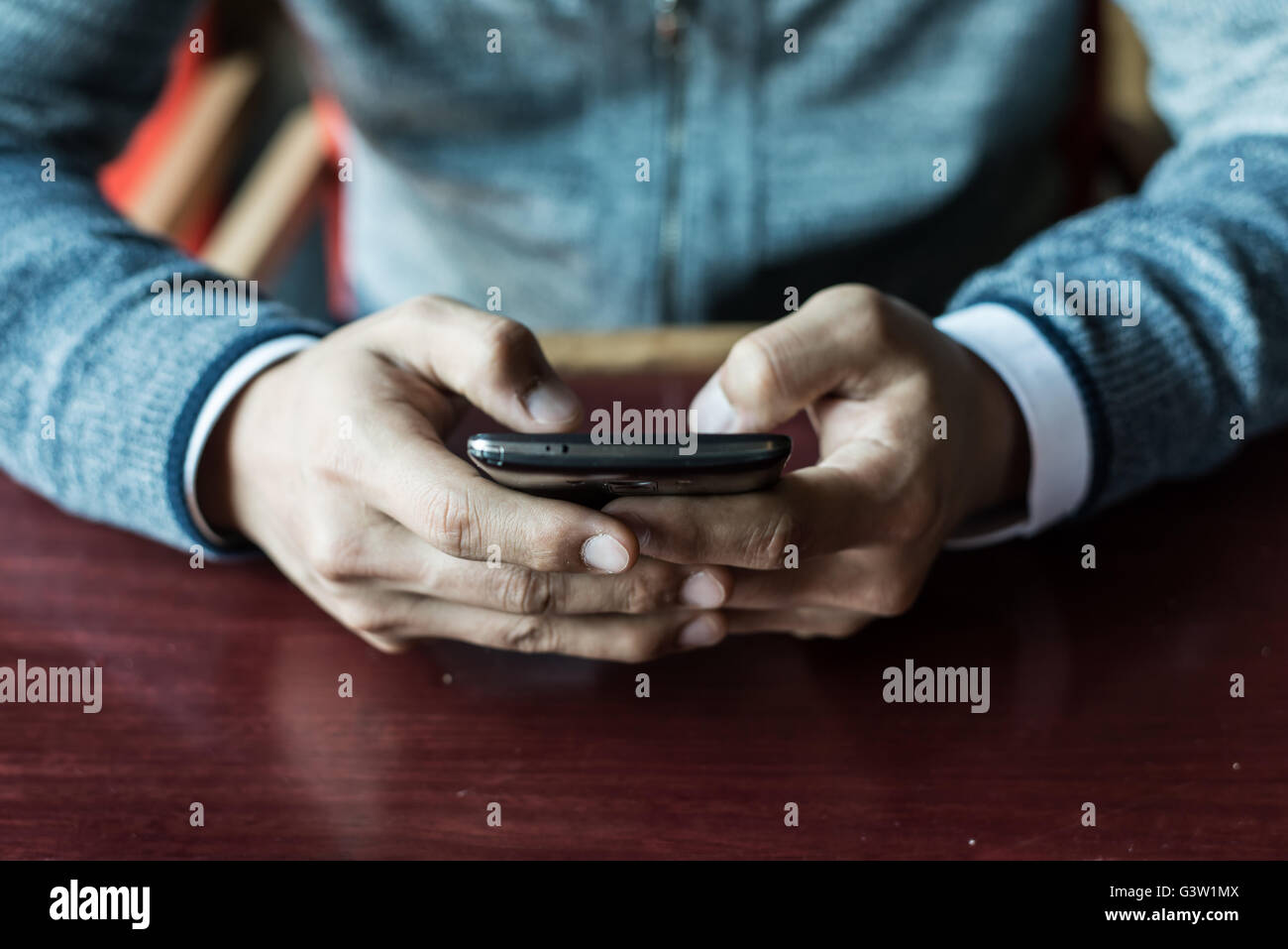 Man using a smartphone Stock Photo