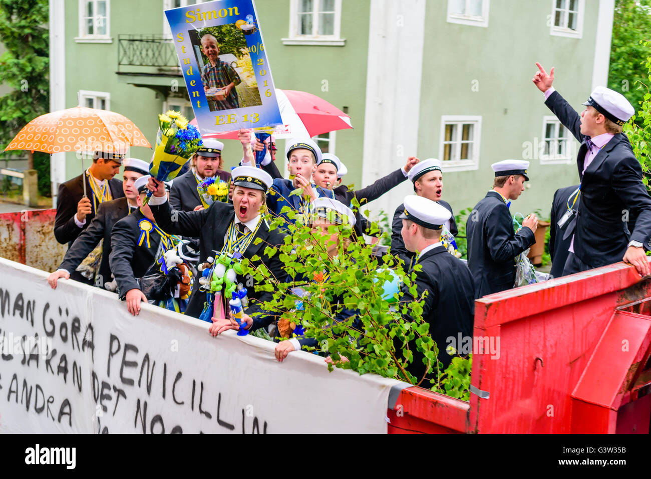 Ronneby, Sweden - June 10, 2016: Students riding on truck and tractor trailers and flatbeds, celebrating their last day in upper Stock Photo