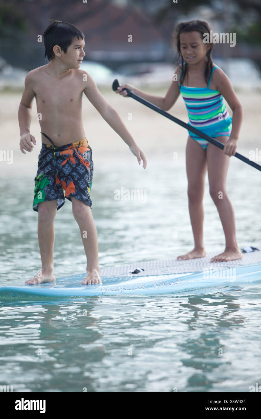Stand up paddle boarding fun at Ala Moana Beach Park, Honolulu, Oahu