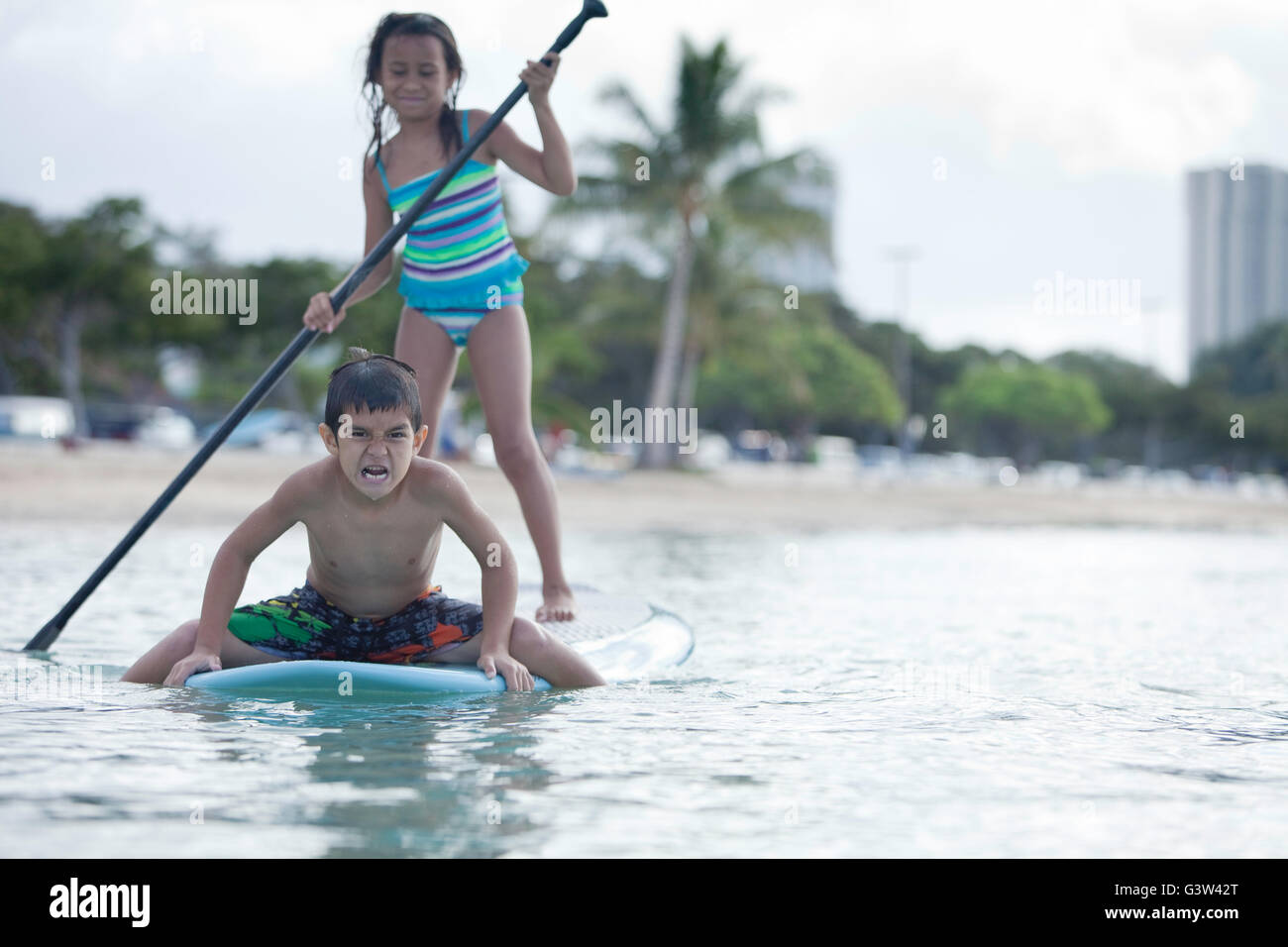 Stand up paddle boarding fun at Ala Moana Beach Park, Honolulu, Oahu