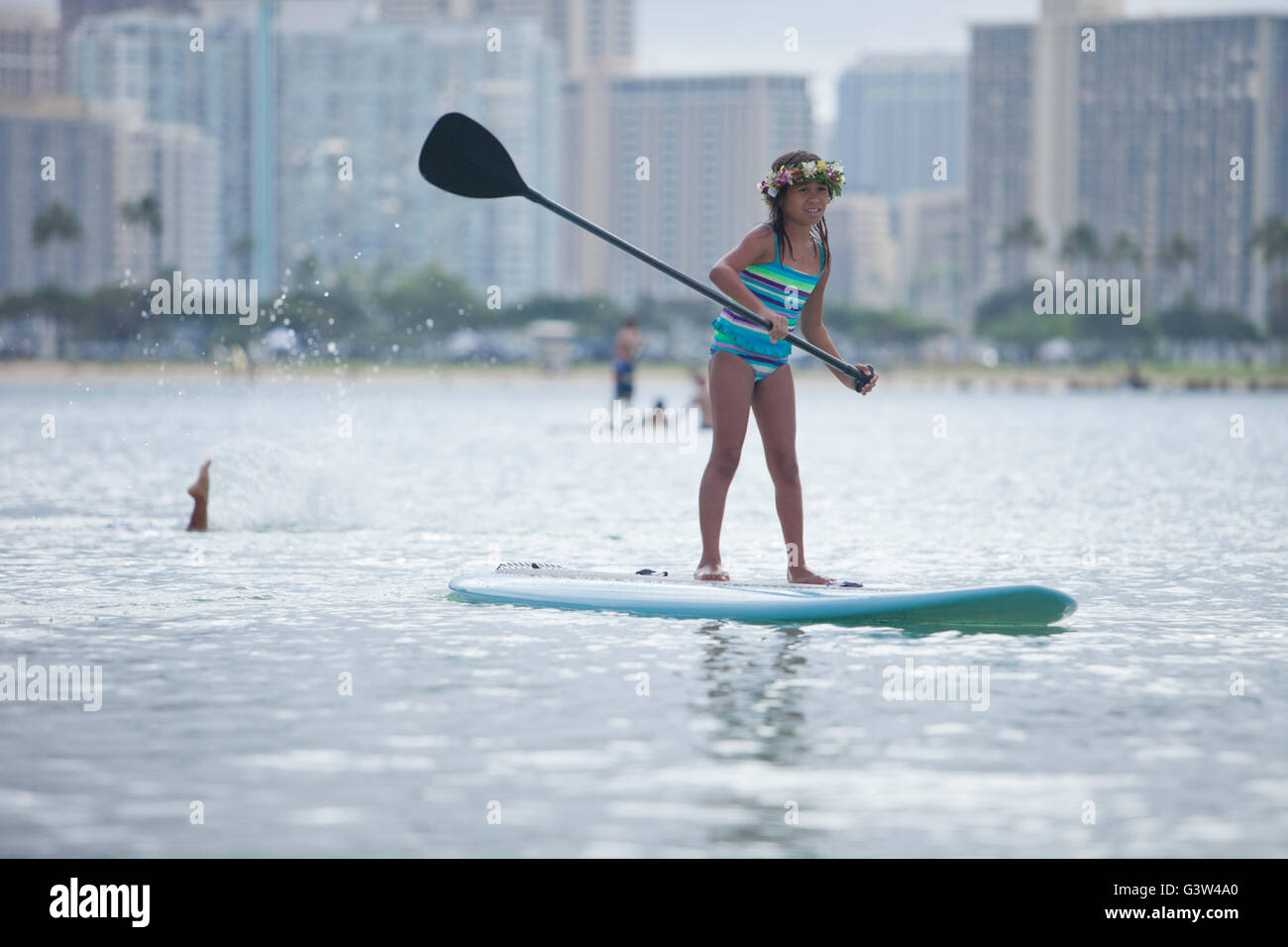 Stand up paddle boarding fun at Ala Moana Beach Park, Honolulu, Oahu