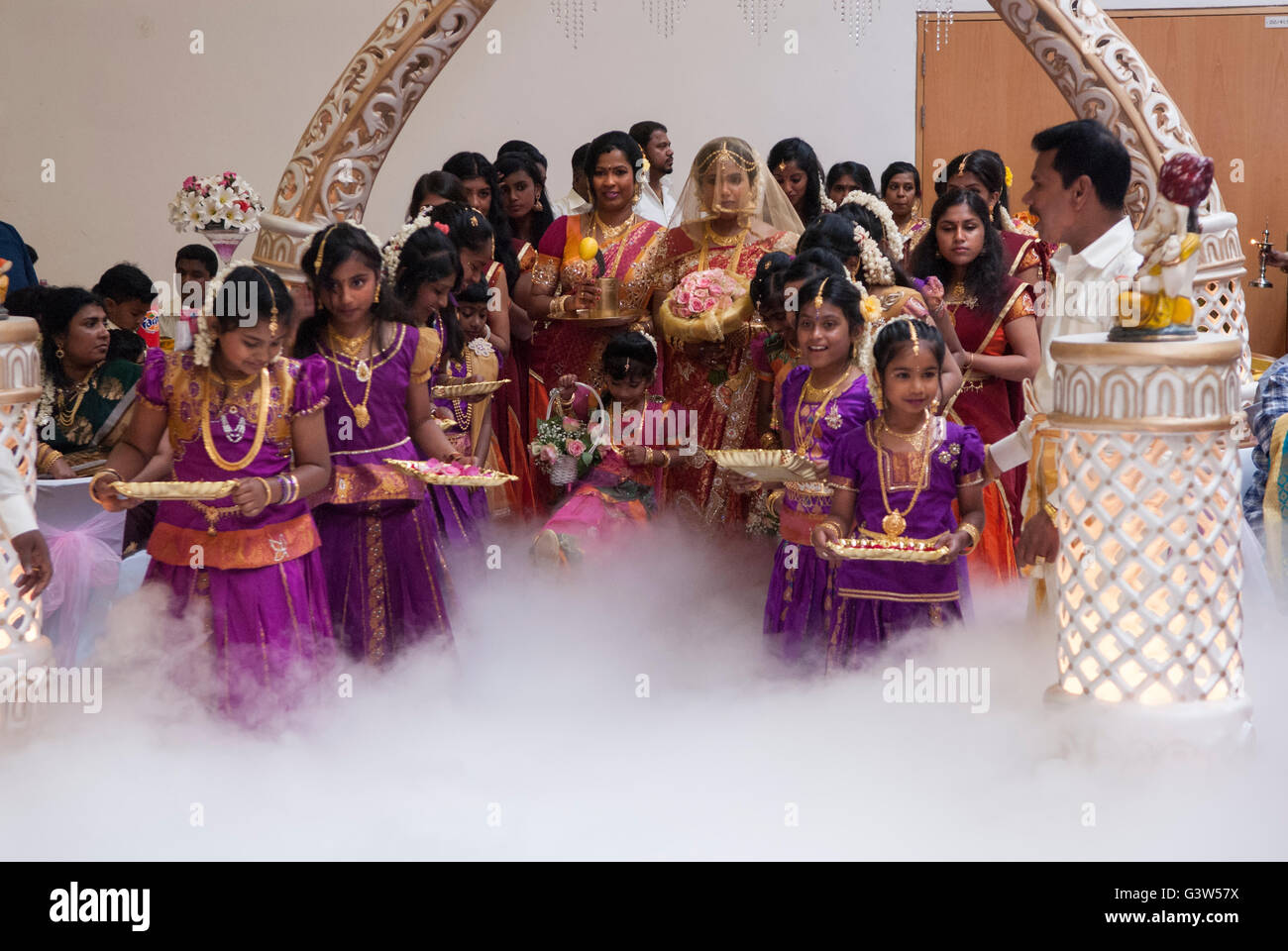 Hindu UK  16 year old Coming of Age celebration puberty party. Ritushuddhi,  also called as Ritu Kala Samskara, Mitcham South London Teenage girl in veil and mother centre of photograph. HOMER SYKES Stock Photo