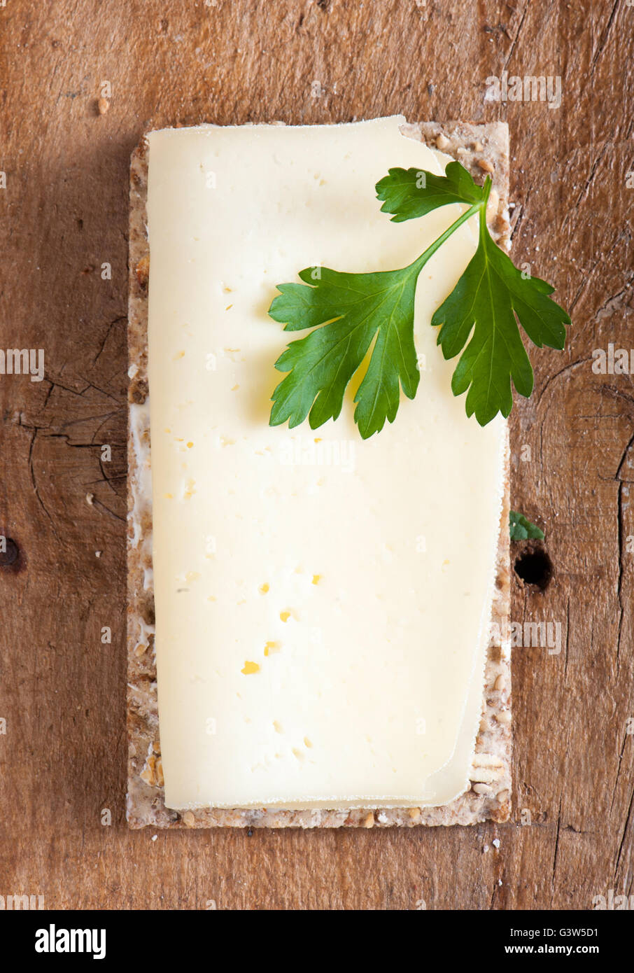 Crisp bread with fresh cheese and parsley Stock Photo