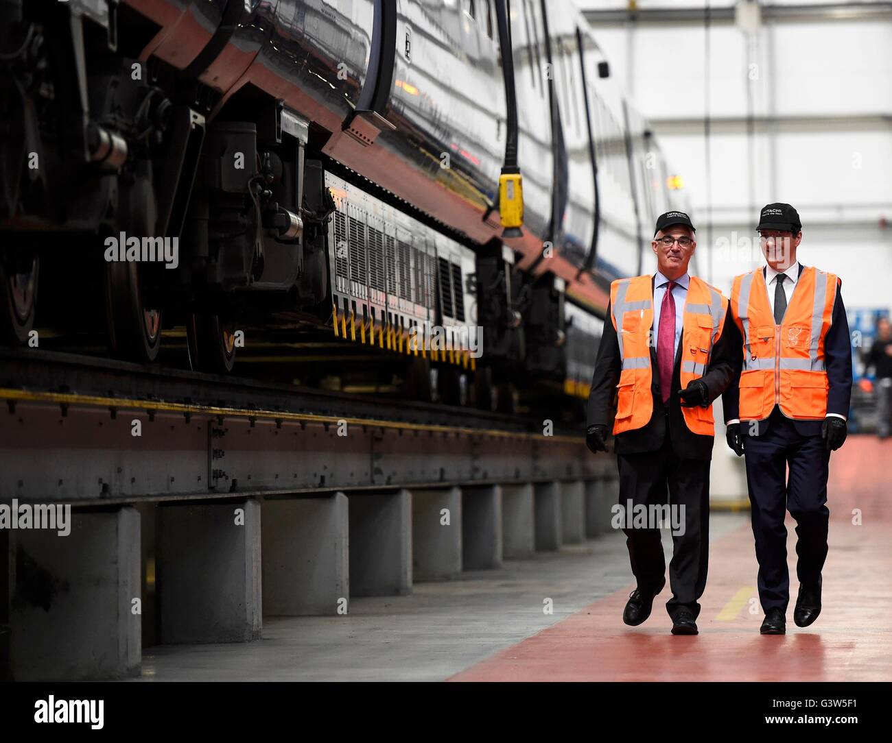 Chancellor George Osborne (right) and former Chancellor Alistair Darling at a pro-Remain event at the Hitachi Rail Europe plant in Ashford, Kent. Stock Photo