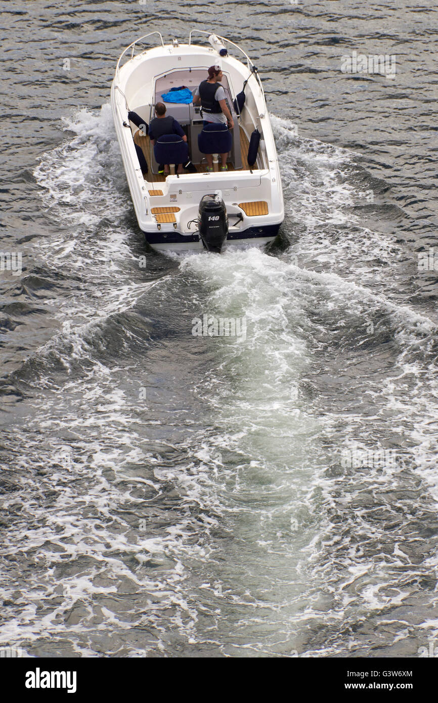 Speedboat with 2 persons aerial view. Stock Photo