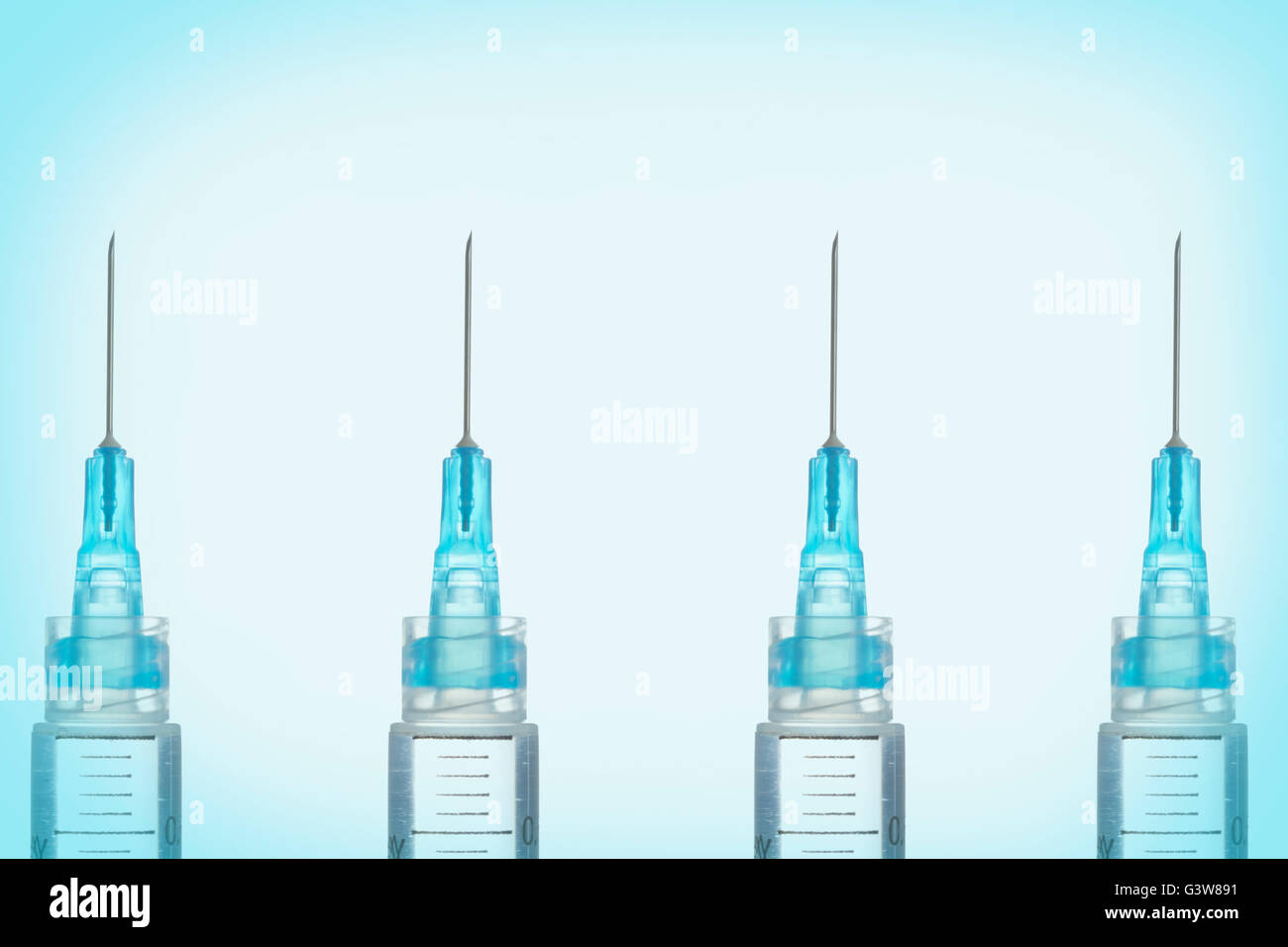 Syringes in row Stock Photo