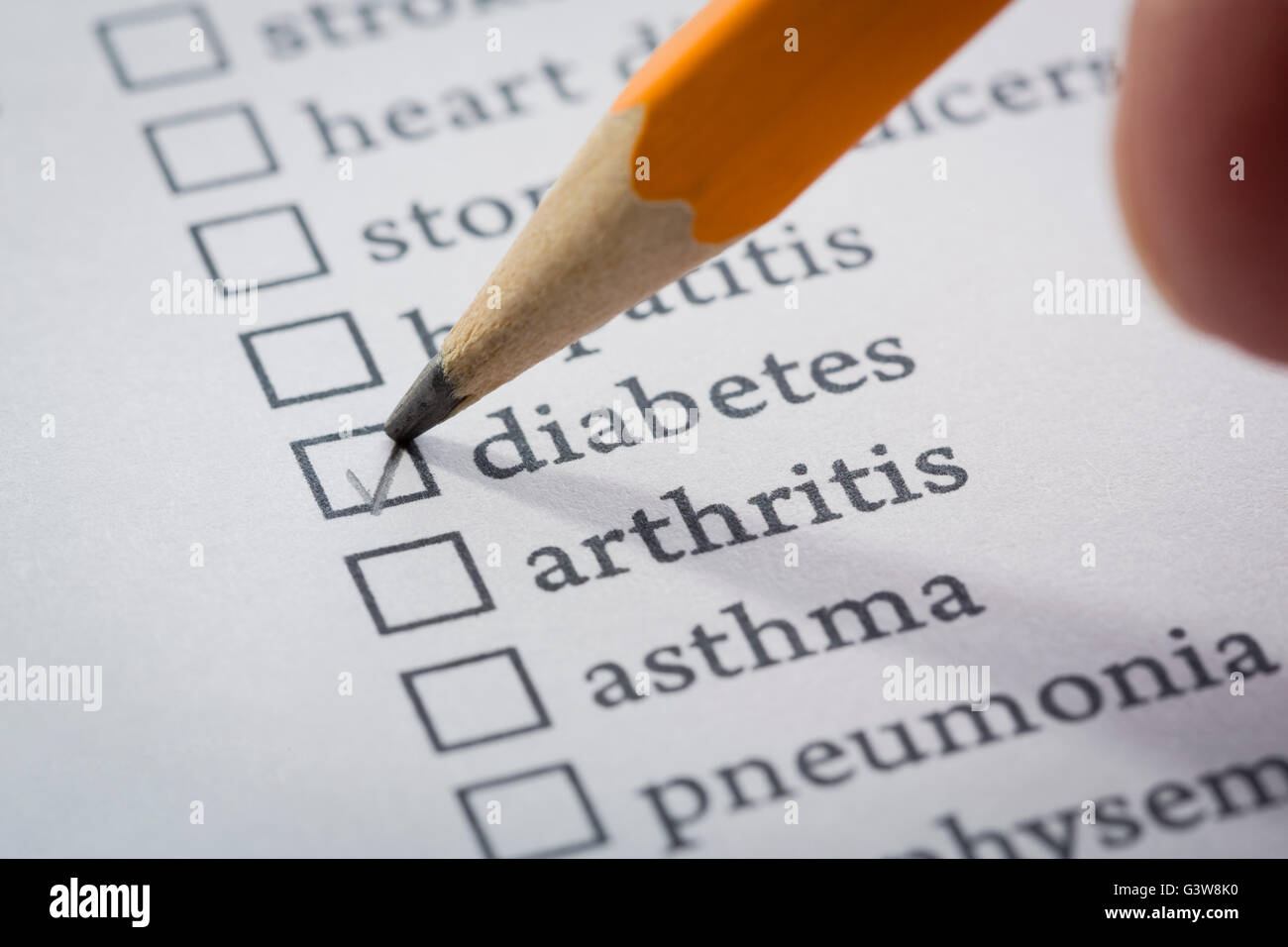 Pen checking out checkbox on list of diseases Stock Photo