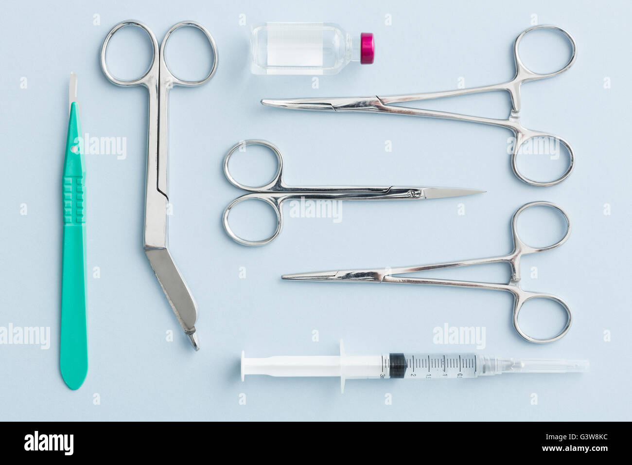 Studio shot of surgical scissors, scalpel and syringe Stock Photo