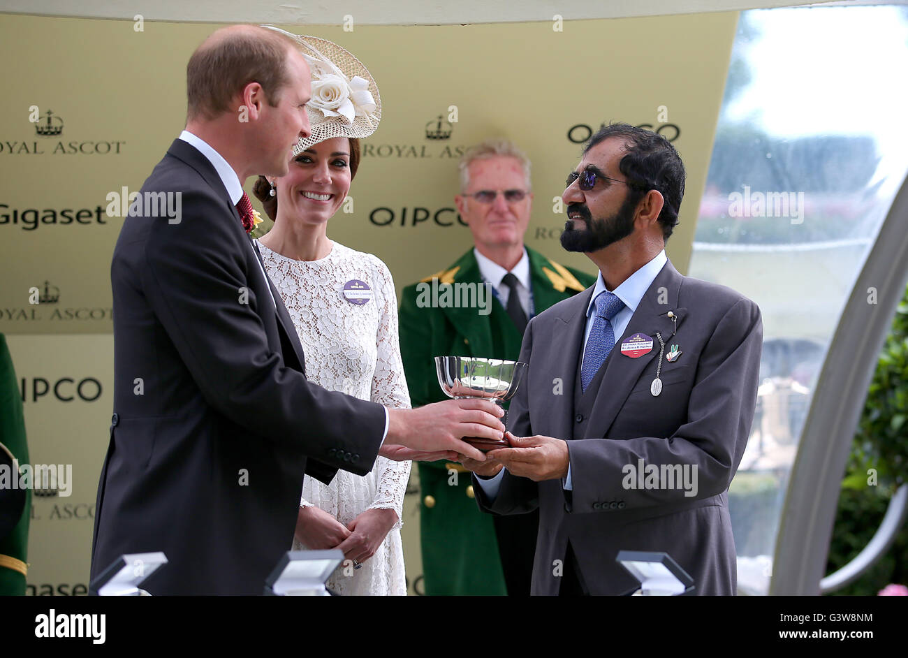 The Duke and Duchess of Cambridge present owner Mohammed bin Rashid Al Maktoum with the trophy after his horse Usherette won the Duke of Cambridge Stakes during day two of Royal Ascot 2016, at Ascot Racecourse. Stock Photo