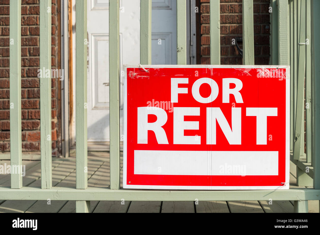 For rent sign posted in front of front porch Stock Photo
