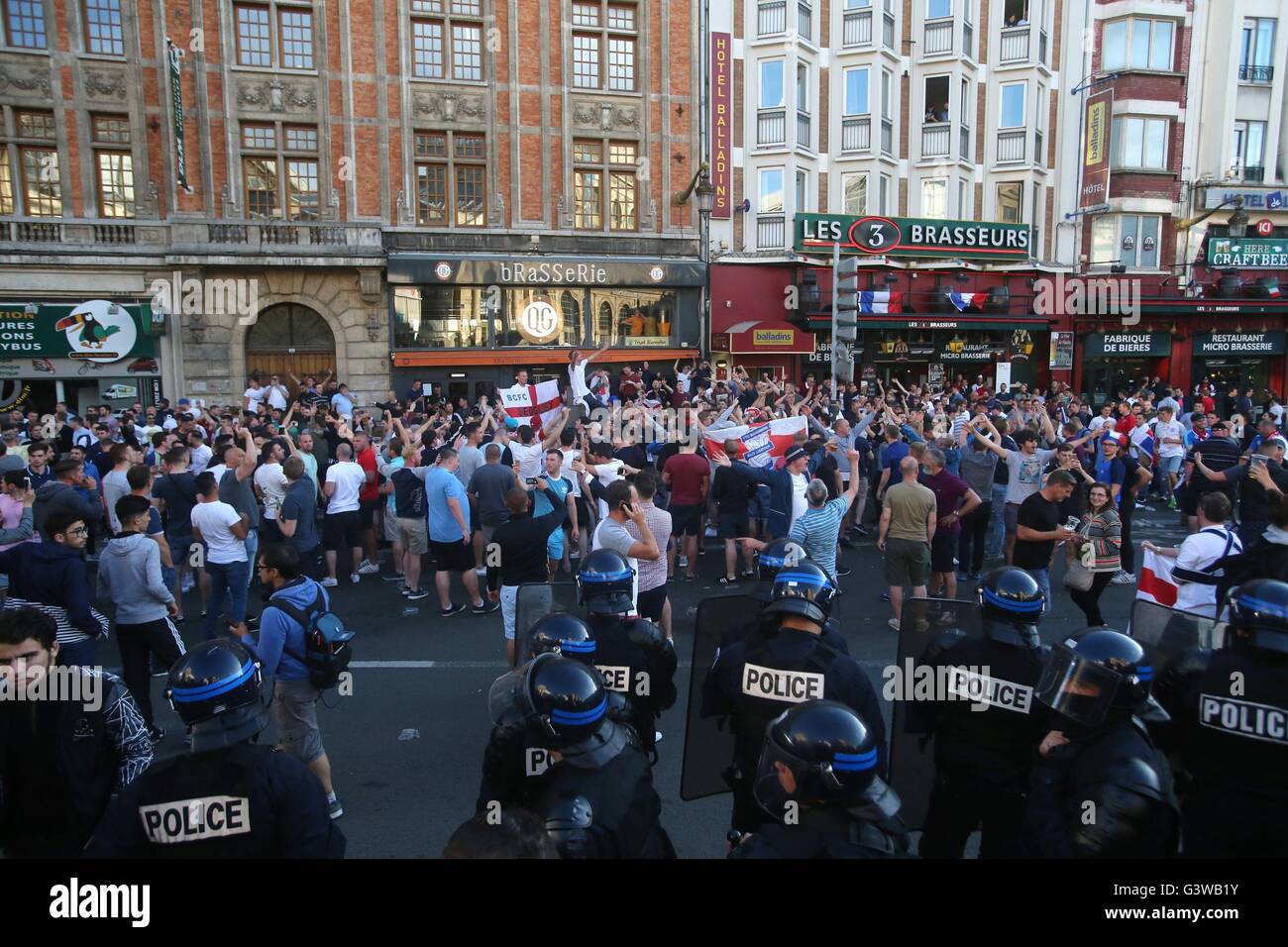 Riot police monitor England fans in Lille city centre, France, as fresh ...