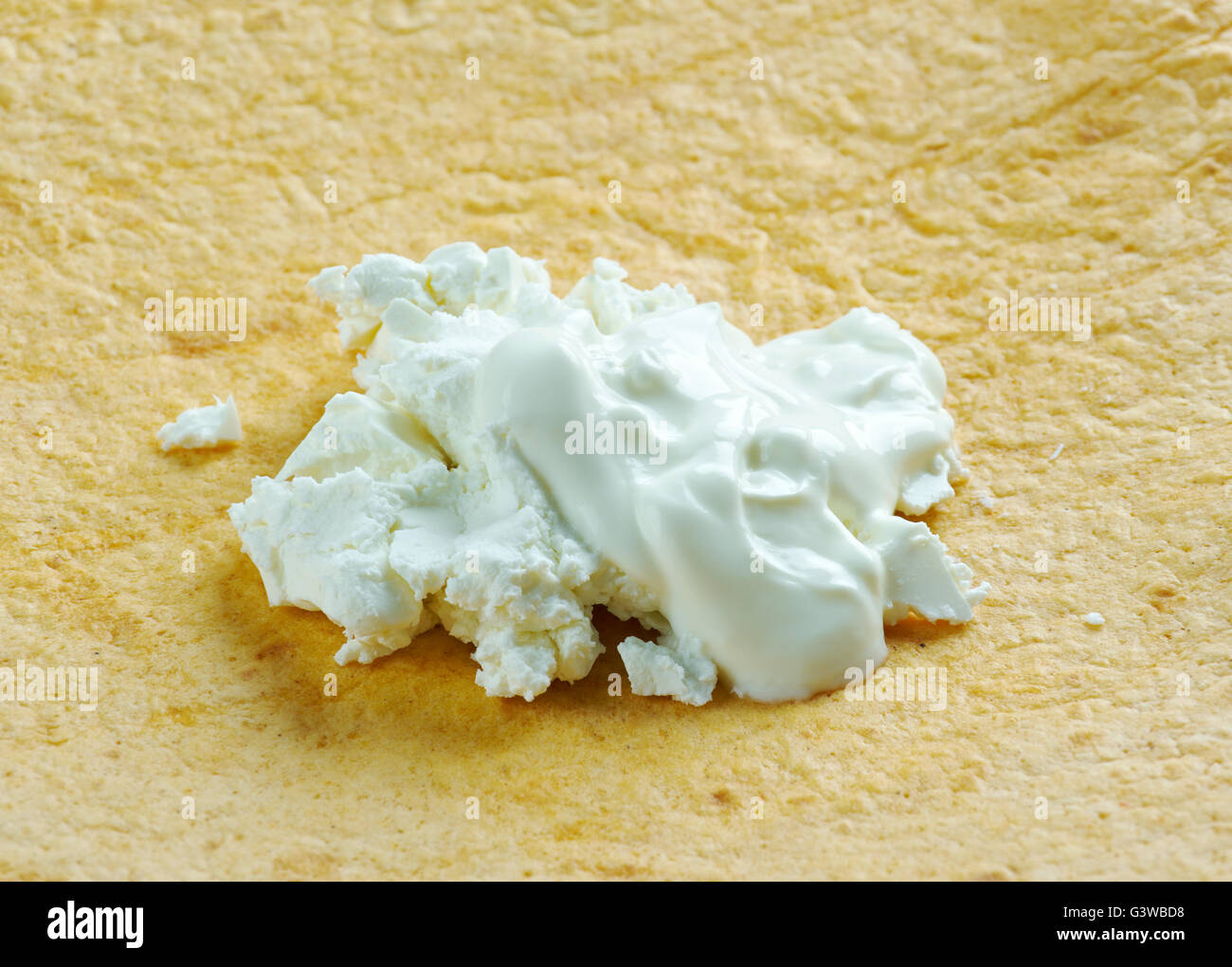 Guirila - tortilla made from young white corn. thick, sweet, filling, and usually eaten with crumbled white cheese. Stock Photo
