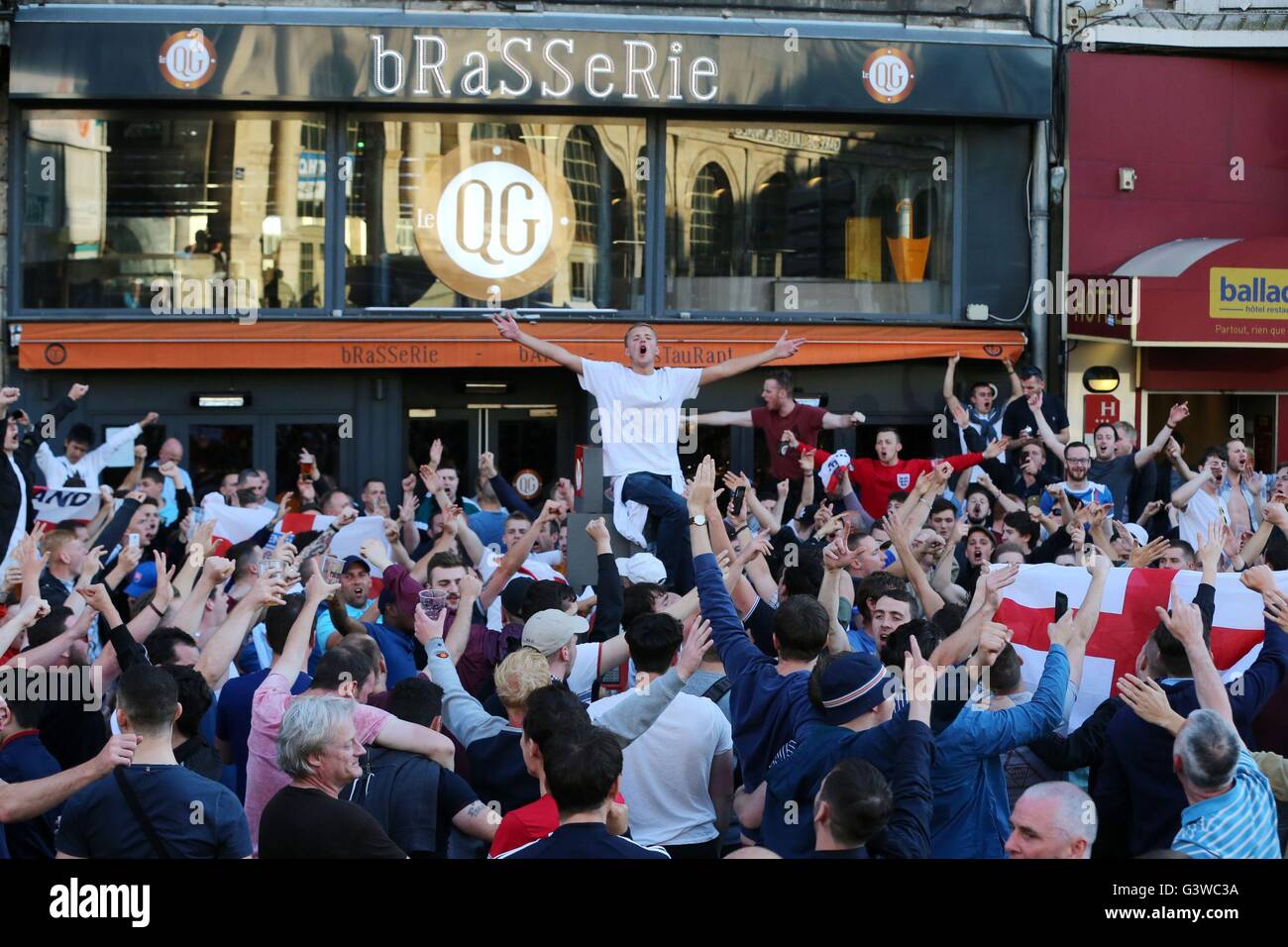 England fans outside the train station in Lille city centre, France, as fresh clashes have taken place between England fans and Russian hooligans at Euro 2016. Stock Photo