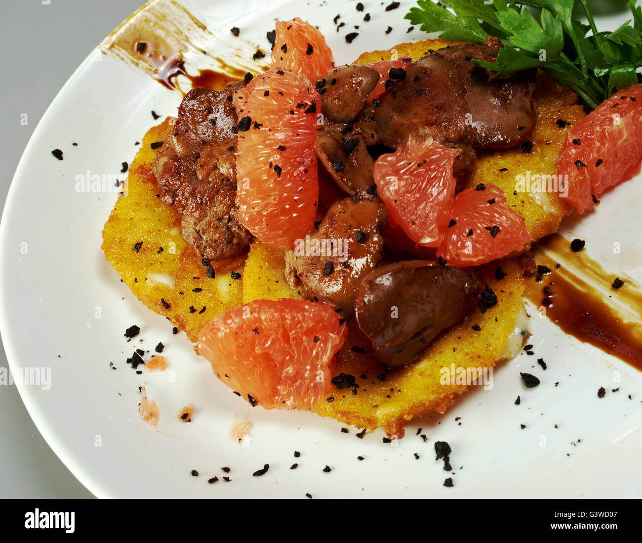 Fried chicken livers and grapefruit Stock Photo Alamy