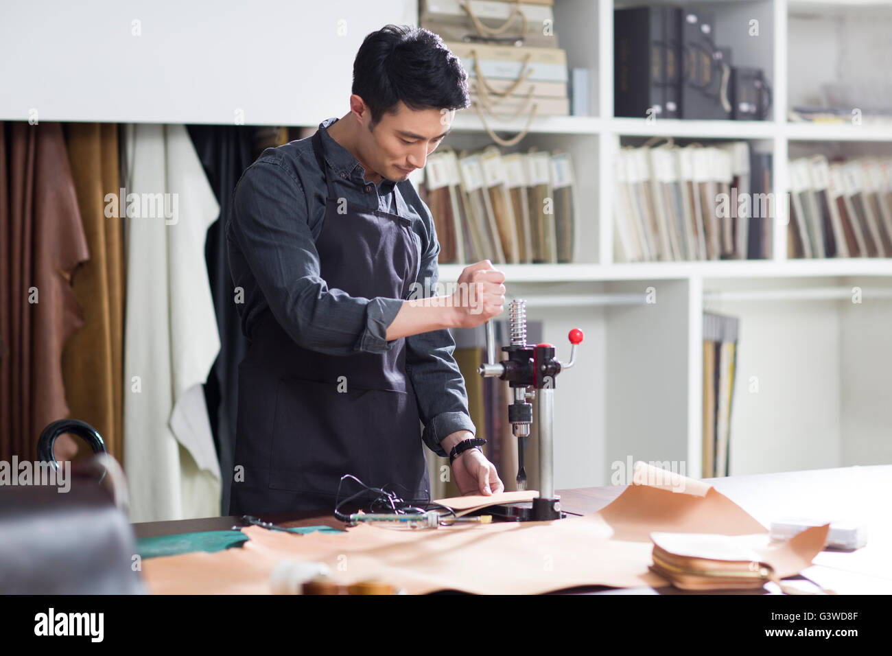 Craftsman working in his studio Stock Photo