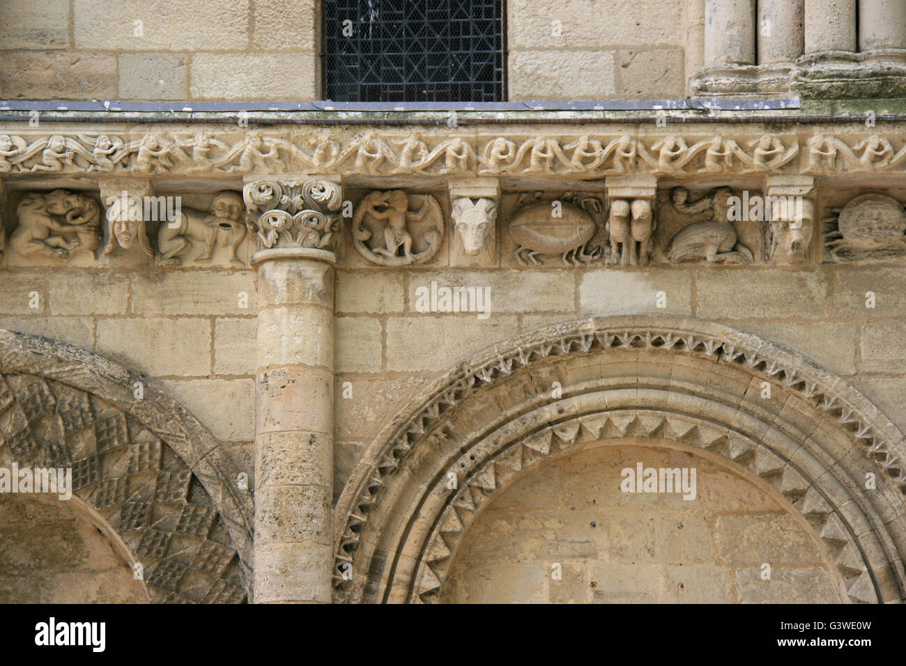 Details of the sculptured decoration of the facade of the Notre-Dame-de-Surgères church in Surgères (France). Stock Photo