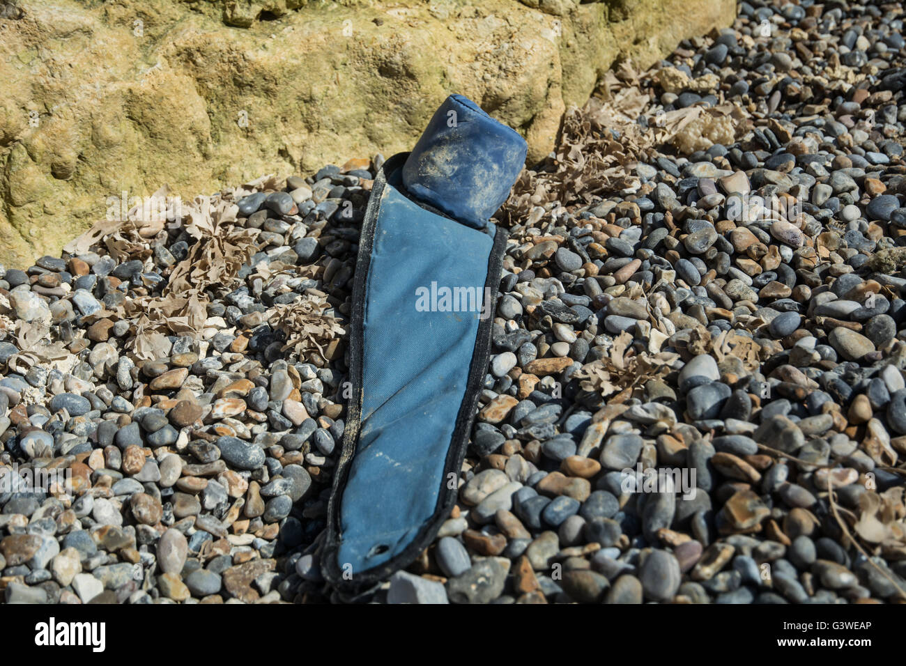 The broken arm of a beach chair, taken on Weybourne beach, Norfolk
