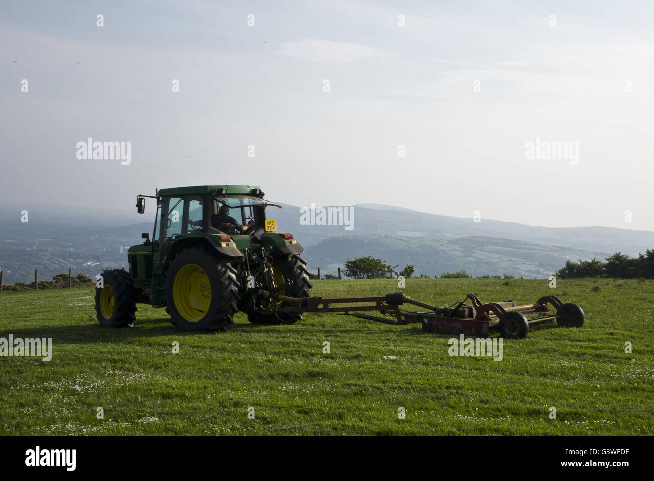 Northern Irish farmer farming on tractor Stock Photo